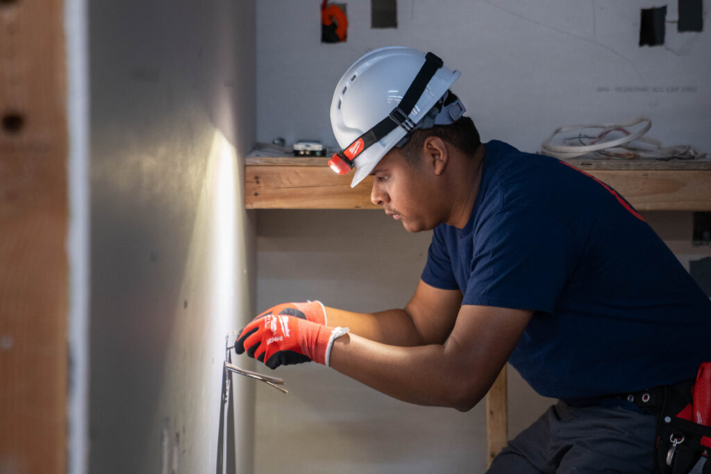 ForgeNow student practicing electrical wiring during hands-on electrician training in Dallas